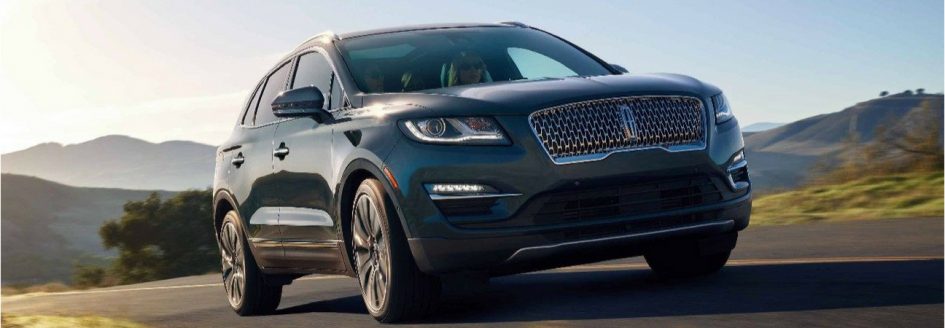 Charcoal 2019 Lincoln MKC cruising a country road